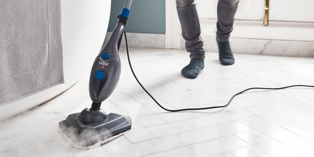 Cleaning a dirty hard floor in winter with a Vax steam cleaner