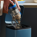 Emptying the dust compartment of a Vax vacuum cleaner