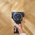 Using a hardworking Vax vacuum cleaner on a parquet floor