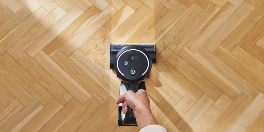 Using a hardworking Vax vacuum cleaner on a parquet floor