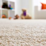 A close-up of a clean beige carpet in a child's bedroom